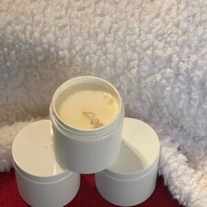 Multiple size hand poured soy candles. Recycled plastic containers used.